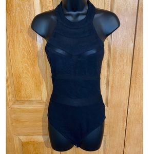 Black body suit. Sheer cut outs.